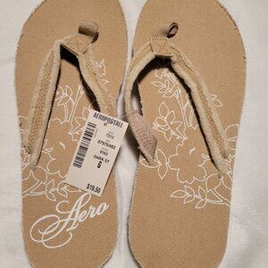 NWT - Aeropostale Brand Tan/Beige Flower Pattern Flip Flops - Size 7